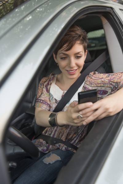Female driver text messaging.
