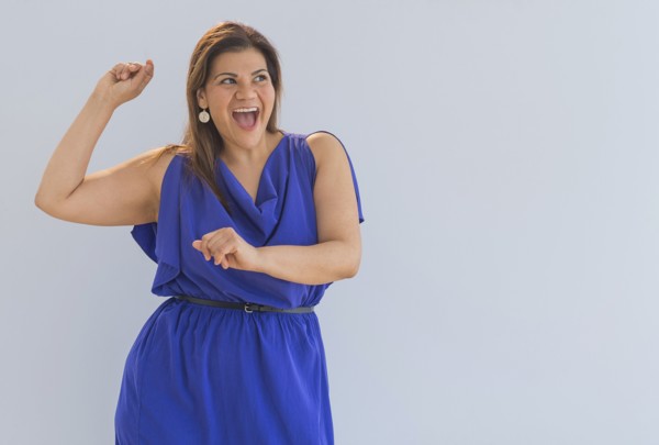 Studio shot of happy woman.