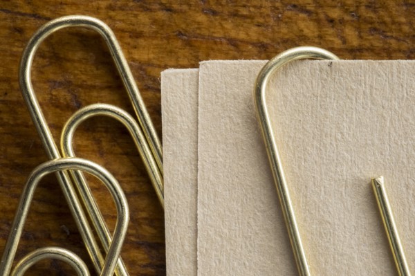 Close up of paper clips and paper.