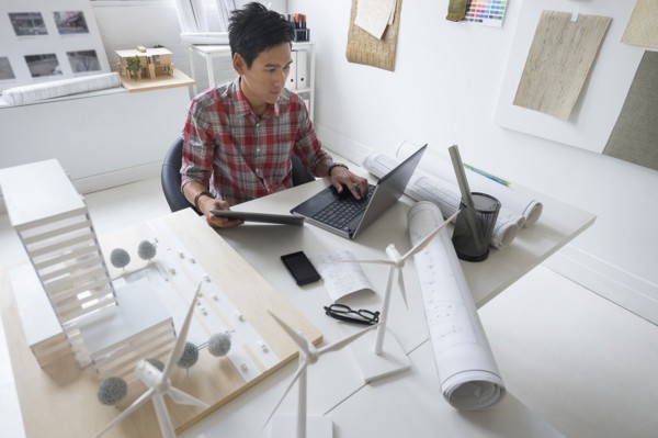 Architect working in office.