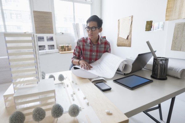 Architect working in office.