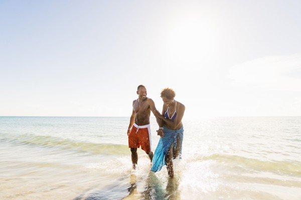 Mature couple walking in sea