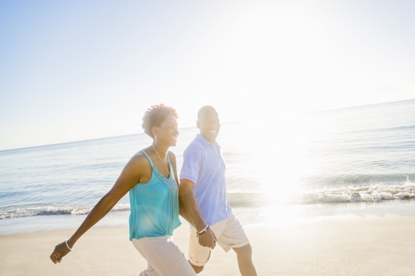 Mature couple walking on beach