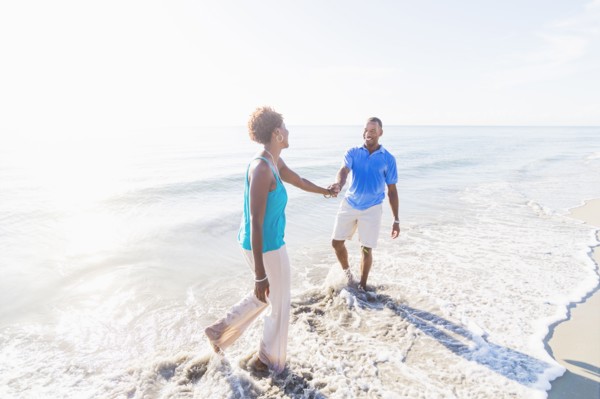 Mature couple walking on beach