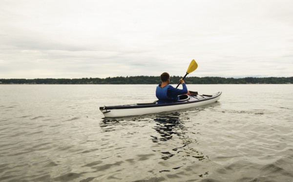 Man kayaking on lake
