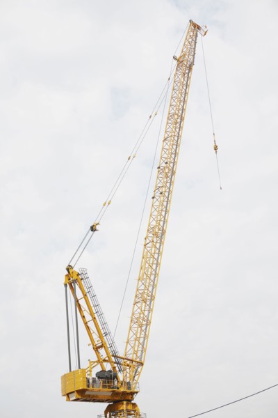 Crane against cloudy sky