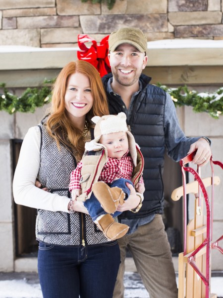 Portrait of family with one child (2-5 months) and sledge