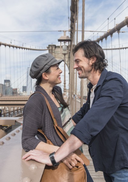 Happy couple on Brooklyn Bridge. Brooklyn, New York.