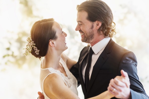 Bride and groom dancing.