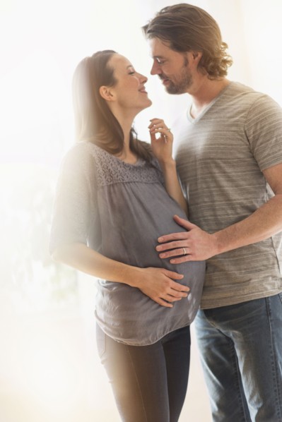 Happy man and his pregnant woman.