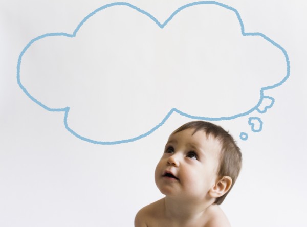 Girl (12-17 months) looking at thought bubble