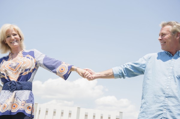 Portrait of smiling couple holding hands