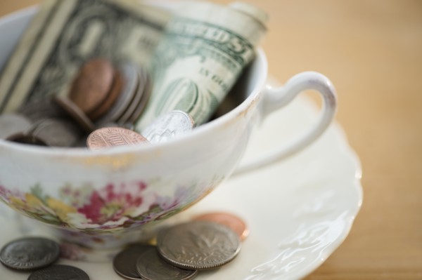 Studio shot of money in tea cup