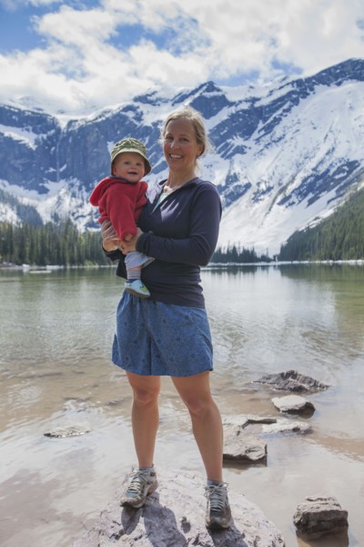 Woman with son (4-5) standing on lakeshore