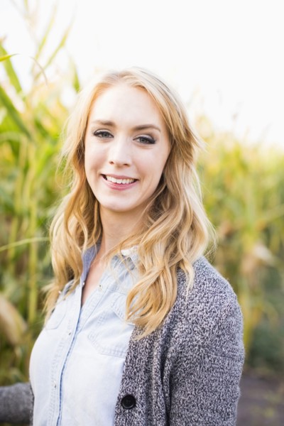 Portrait of young woman in corn field