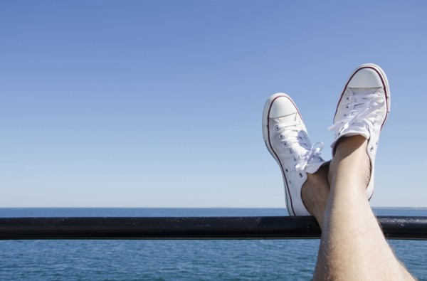 Man's feet on ferry boat
