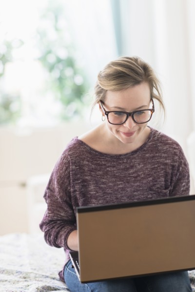 Young woman using laptop.