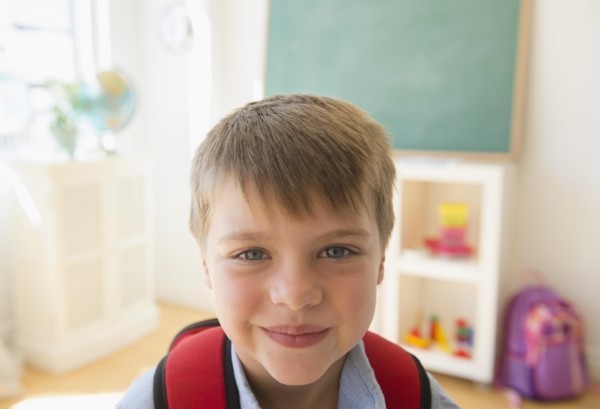 Portrait of boy (6-7) in classroom