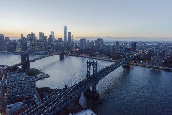 Lower Manhattan, View of Brooklyn Bridge and One World Trade Center at dusk
