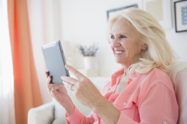 Portrait of senior woman using digital tablet