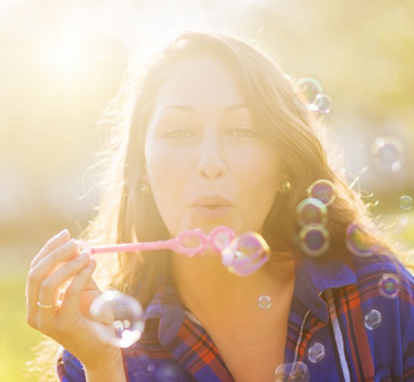 Woman blowing bubbles