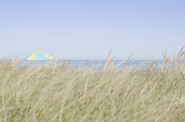 View of beach umbrella by sea