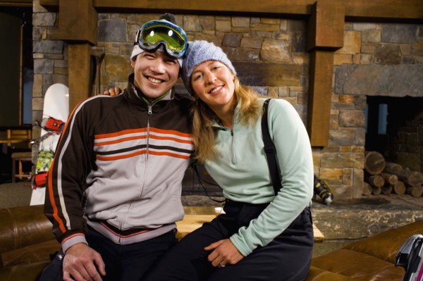 Portrait of couple in front of fireplace