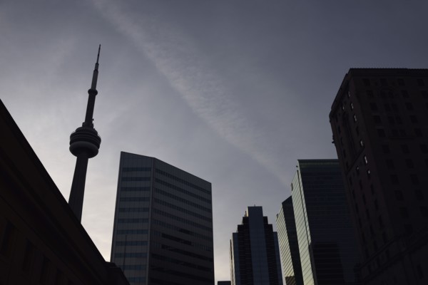 Low angle view of city architecture and communications tower