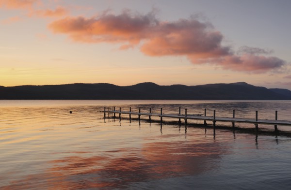 Jetty on lake at dawn