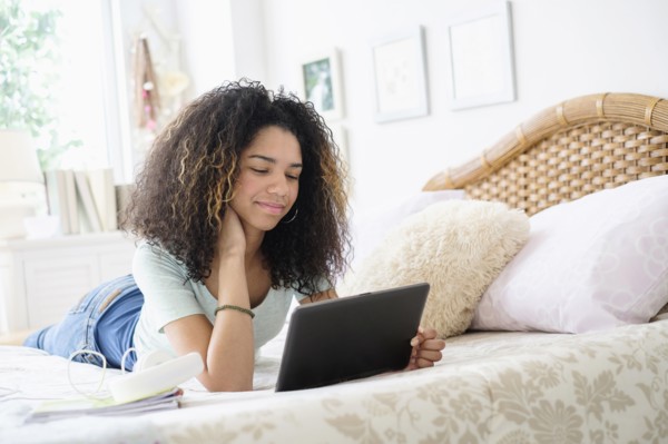 Teenage girl (16-17) using tablet pc.