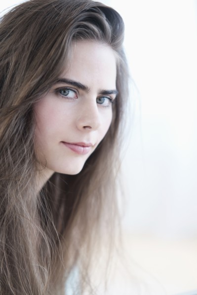 Portrait of young woman with blue eyes.