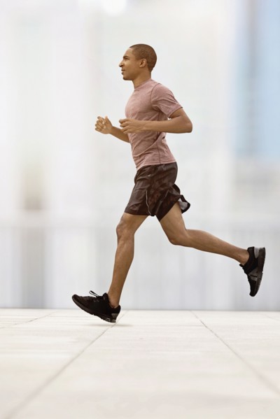 Mid adult man running.