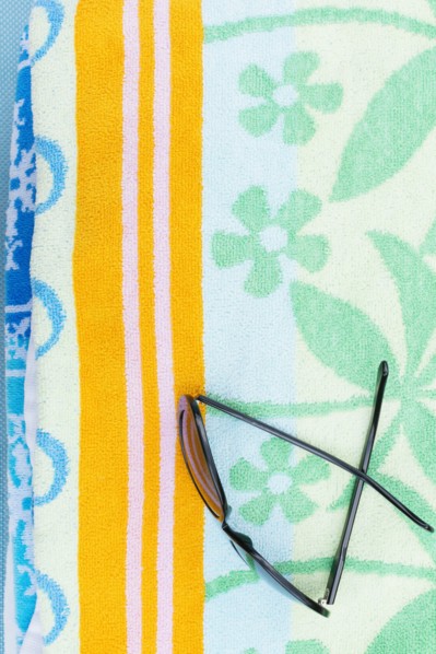Sunglasses on towel