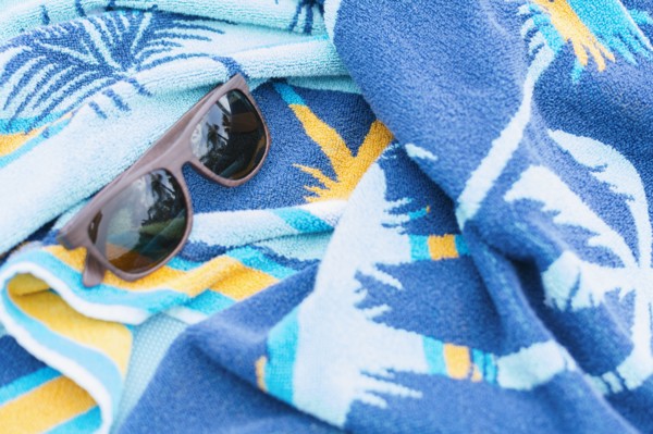 Sunglasses on towel