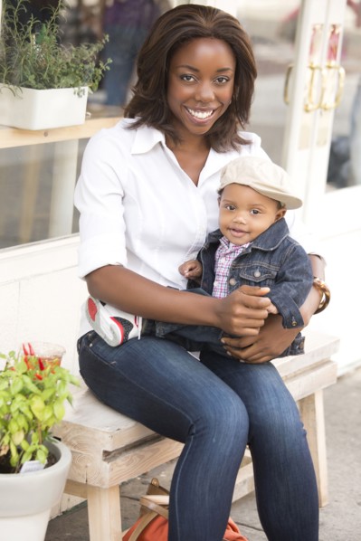 Portrait of smiling woman holding son (12-17 months)