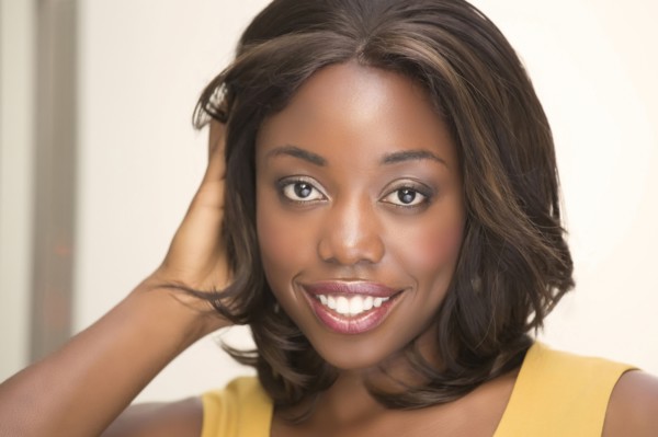 Smiling woman with hand in hair