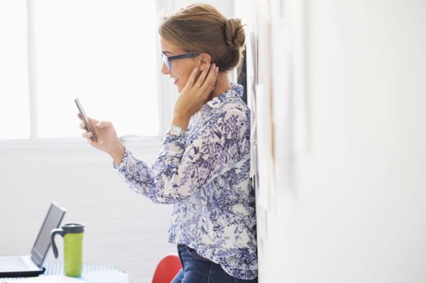Young woman working in office.