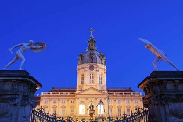 Charlottenburg Palace facade and entrance statues at night