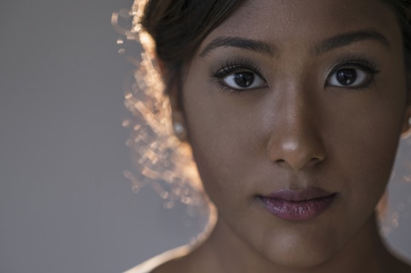 Portrait of young woman in studio.