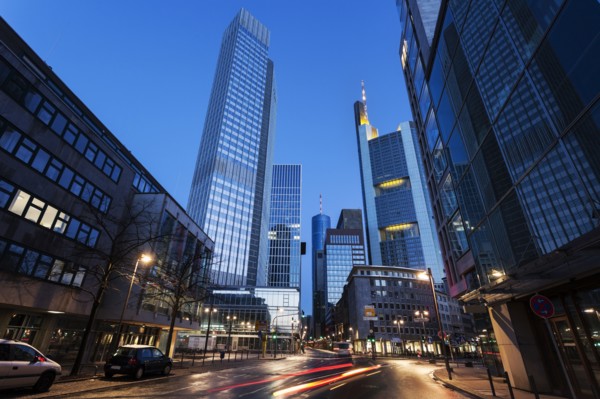 Illuminated city street with skyscrapers