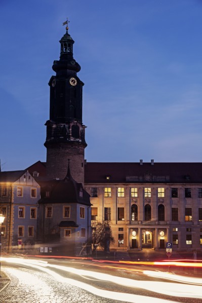Light trails and clock tower at night