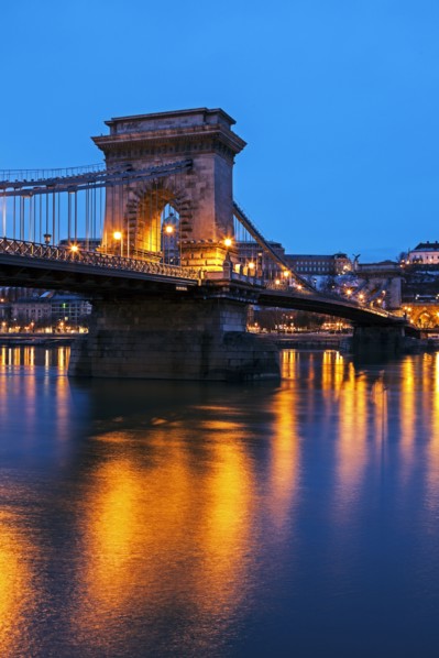 Illuminated Chain Bridge and reflections on water