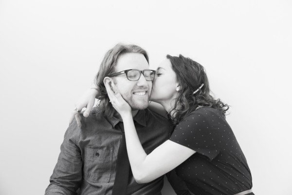 Woman kissing smiling man