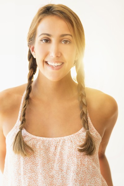 Portrait of young woman in studio.
