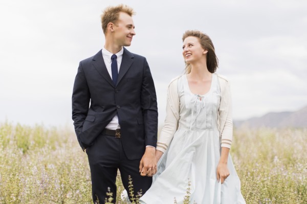 Newlywed couple in field