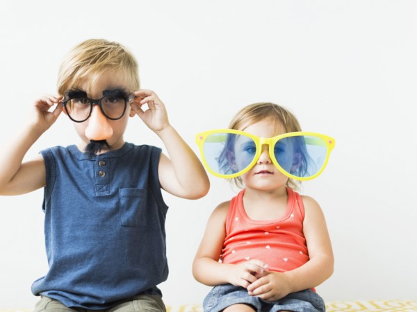 Children (2-3) wearing novelty glasses