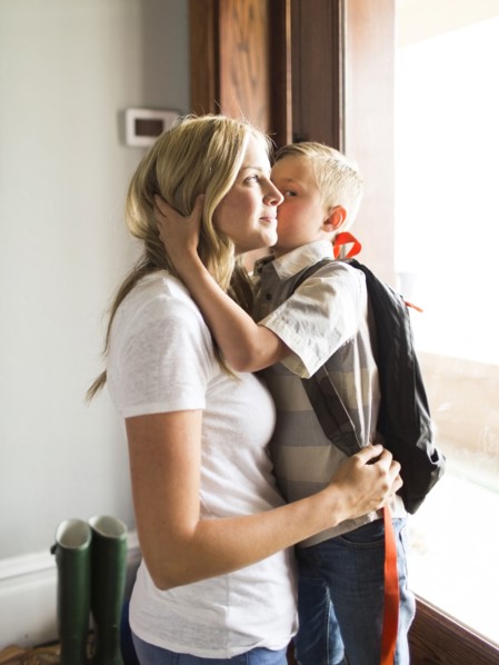 Son (6-7) kissing mother on cheek