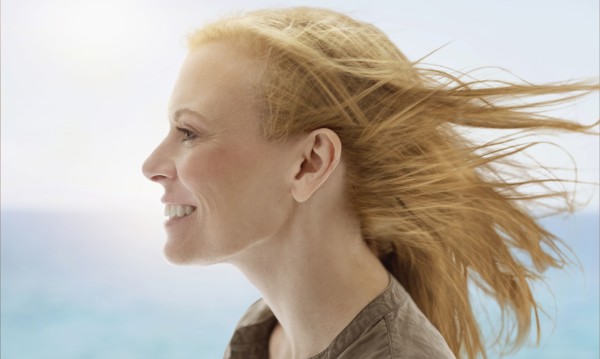 Portrait of woman by sea.