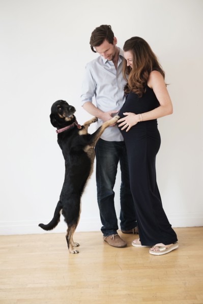Portrait of couple with dog.