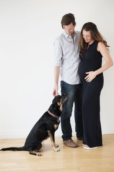 Portrait of couple with dog.